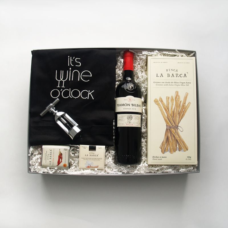 Caja regalo original para el día del padre con esta caja de picoteo gourmet, podrá disfrutar de un excelente aperitivo acompañado de un vino Rioja. Idea para el día del padre.